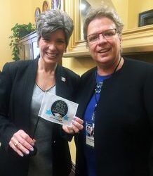 Robin Walenta of West Music Presents Award to Iowan Senators