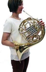 holding a french horn